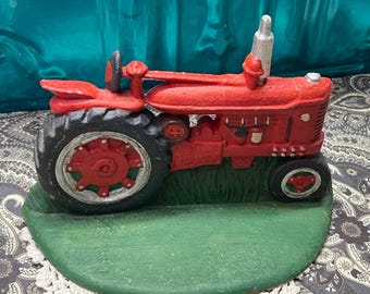 Vintage small cast iron tractor door stopper