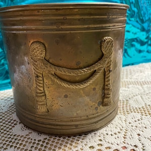 Vintage rustic brass planter pot with rope and tassel detail - showing it’s age - patina