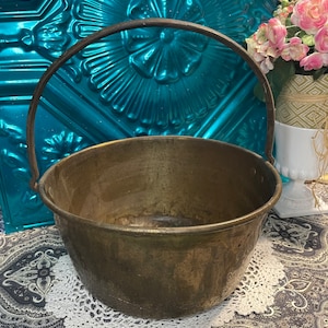 Vintage large rustic brass pot with iron handle - clearly showing it’s age