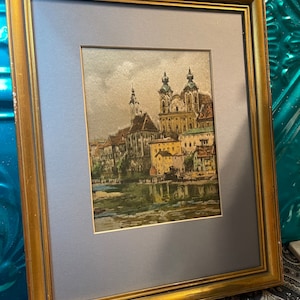 Vintage matted print of European church in aged wood frame