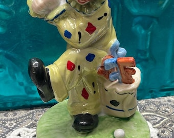 Vintage ceramic clown golfer music box