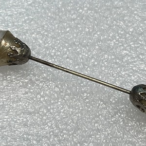 Antique double sided hat or lapel pin with pearl or pearl looking ends and crown like details- aged