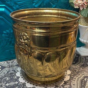 Vintage unique England brass planter with lion heads- aged