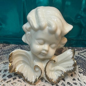 Vintage small ceramic cherub wall hanging with gilded details