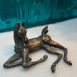 Vintage heavy bronze tone metal laying horse - foal statue- no base