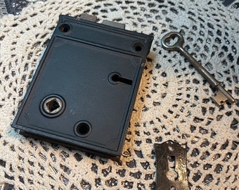 Vintage lock with key and key hole face plate