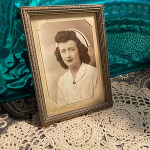 Vintage nurse photo in ornate wood frame- showing its age
