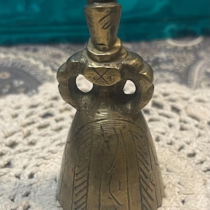 Vintage small unique brass lady bell- aged