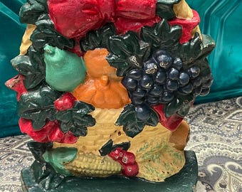 vintage 3.12 lbs cast iron fruit basket door stopper- aged- lots of wear