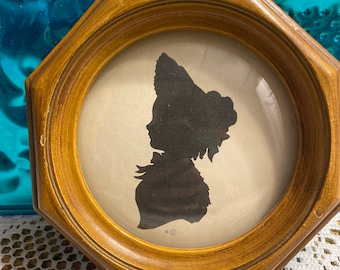 Antique silhouette picture framed in convex bubble glass frame