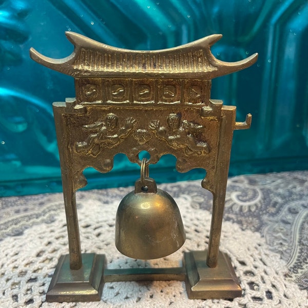 Vintage small brass pagoda bell gong with cherub design - aged - no hammer