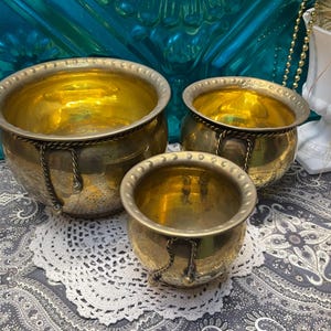 Vintage set of 3 brass planters with rope and tassel detail- different sizes