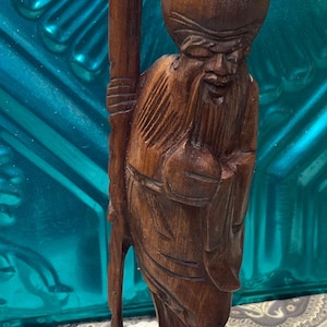 Antique or vintage wood carved Chinese god statue