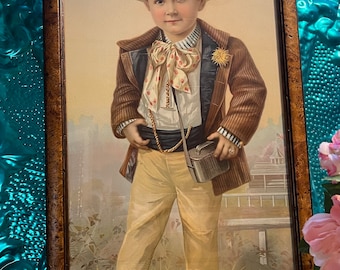 Antique or vintage large print of dressed up boy in vintage wood frame- showing its age