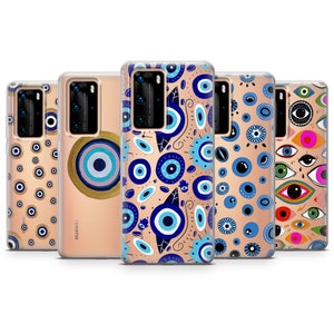May include: Several phone cases showcasing different designs with blue and white evil eye patterns. The cases have a transparent background. Some cases feature a gold accent. The cases are designed for a mobile phone.