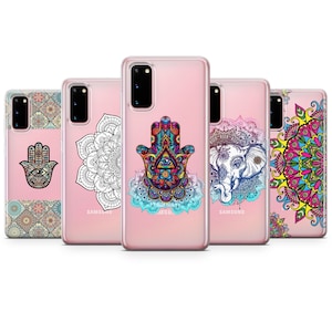 May include: Five different phone cases featuring colourful mandala and hamsa hand designs. The cases are clear and allow the phone's colour to show through the design.
