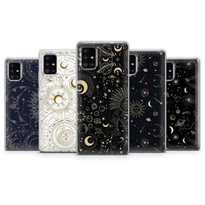 May include: Five different phone cases featuring a celestial design. The cases are clear and showcase a black and gold design with stars, moons, planets, and other celestial objects.