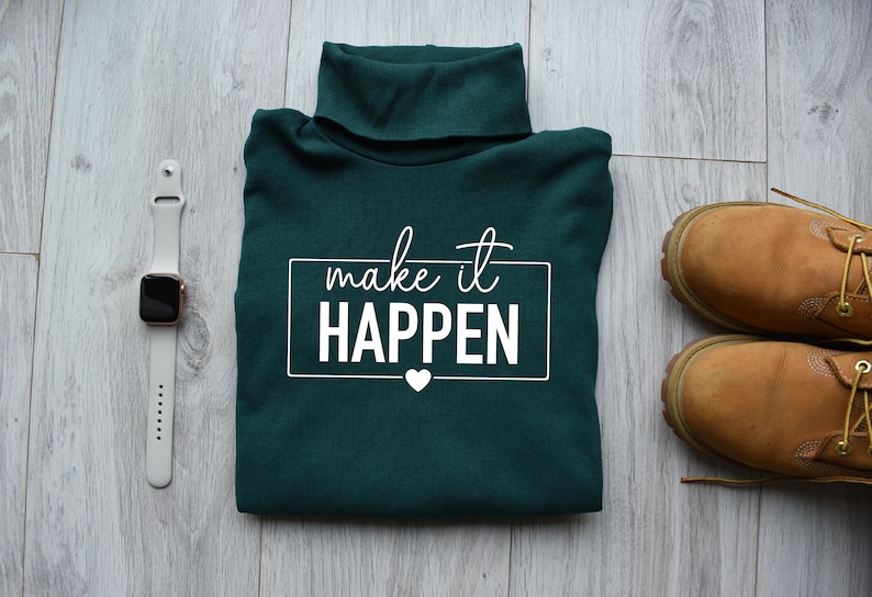 May include: A dark green turtleneck sweater with the text "make it HAPPEN" in white lettering. A small white heart is below the text.