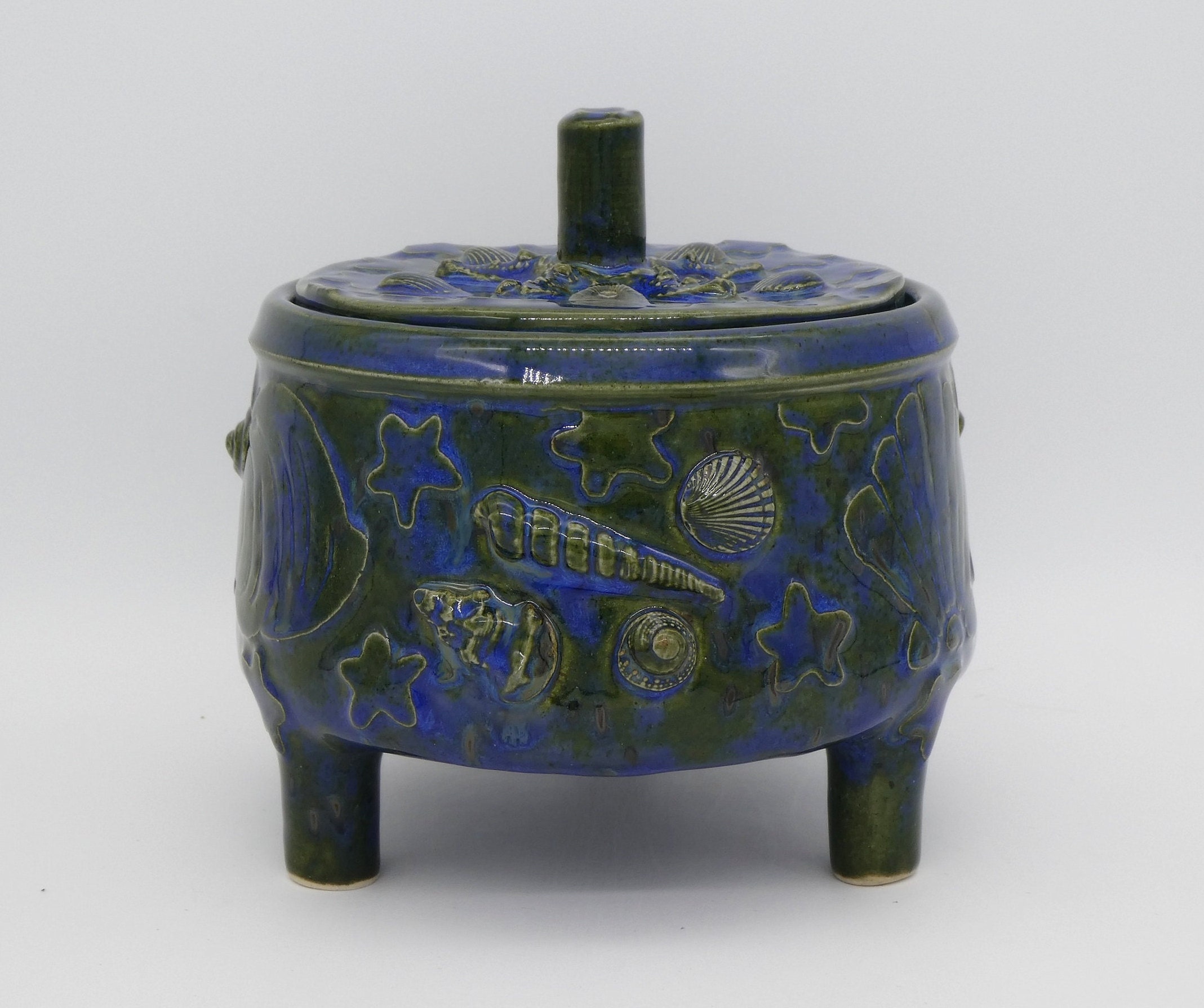 ceramic pot with legs