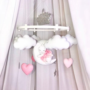 Nursery decor. Baby mobile for girl bunny rabbits pink hanging crown white crib felt. Baby shower gift. Pregnancy New Parents Newborn gift.