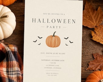 May include: A cream-colored Halloween party invitation card featuring black text that reads YOU'RE INVITED TO A HALLOWEEN PARTY, EAT, DRINK & BE SCARY, SATURDAY, OCTOBER 26TH, 7:00 PM, 123 SPOOKY LANE, ANYWHERE, ANYWHERE, RSVP TO STELLA 555 123-4567.
