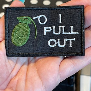 May include: Black embroidered patch with a green grenade and white text that reads "I PULL OUT".