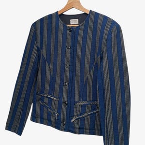 May include: A set of three ceramic nesting bowls in shades of blue, green, and white. The bowls feature a speckled glaze and a simple, modern design. The largest bowl is approximately 6 inches in diameter.