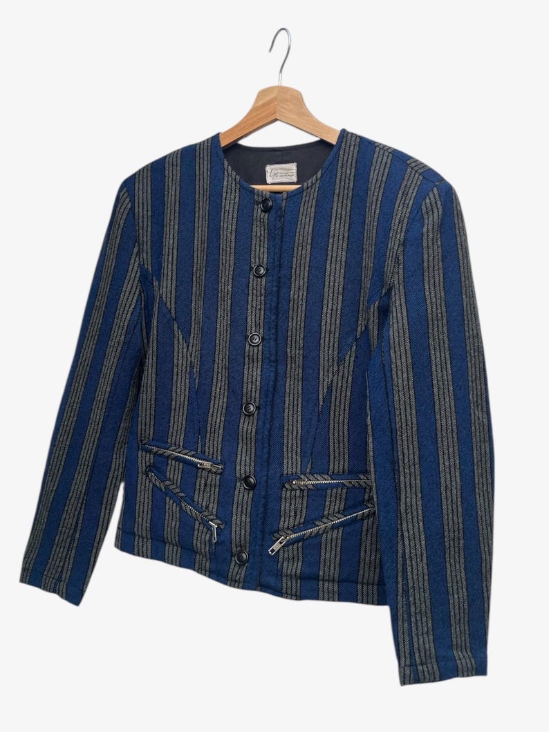 May include: A set of three ceramic nesting bowls in shades of blue, green, and white. The bowls feature a speckled glaze and a simple, modern design. The largest bowl is approximately 6 inches in diameter.