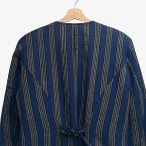 May include: A set of three ceramic mugs with a speckled, matte finish. The mugs are in shades of cream, light gray, and dark gray. Each mug has a simple, minimalist design and a rounded handle.