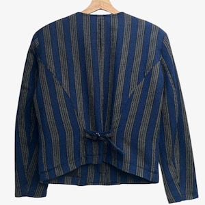 May include: A set of three ceramic mugs with a speckled, matte finish. The mugs are in shades of cream, light gray, and dark gray. Each mug has a simple, minimalist design, perfect for coffee or tea.