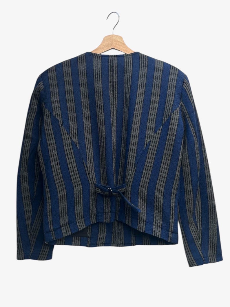 May include: A set of three ceramic mugs with a speckled, matte finish. The mugs are in shades of cream, light gray, and dark gray. Each mug has a simple, minimalist design, perfect for coffee or tea.