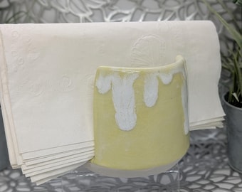 Hand thrown and carved slight rectangular porcelain napkin holder in pale yellow and white glaze, 3.9x3.5