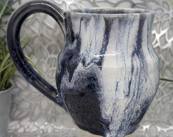 Hand thrown discounted 24 oz tall porcelain mug in dark blue and white glaze.