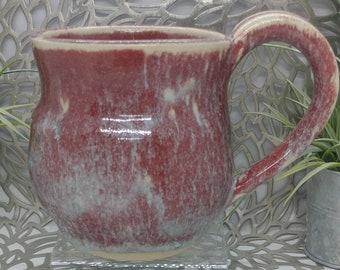 Hand thrown 22 oz white stoneware mug in snowy plum glaze