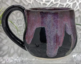 Hand thrown small 14 oz porcelain coffee cup in obsidian purple maroon and gold.