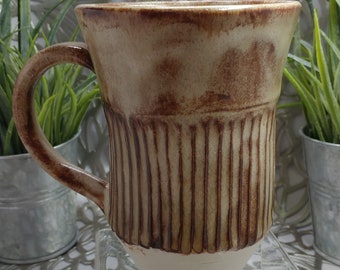 Elegant handmade,fluted stoneware mug in classic Shino glaze