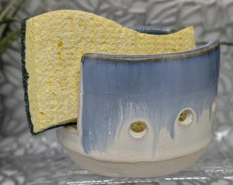 Hand thrown and carved vented porcelain sponge holder in white and weeping blue with two drain holes. 4x2.8.