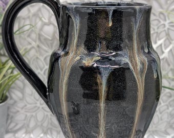Discounted huge 28 oz tall porcelain mug in obsidian with smoke and gold glitter.
