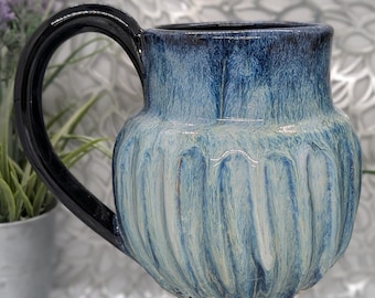 Huge discounted 29 oz tall fluted porcelain mug in melting pond glaze result.