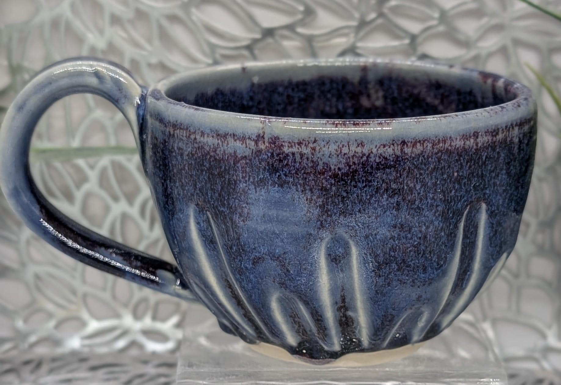 Hand thrown 16 oz footed fluted porcelain coffee cup in rare copper blue  red glaze.