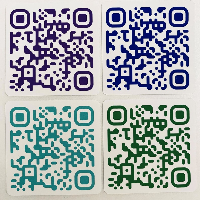 May include: Four square QR code stickers in shades of purple, blue, teal, and green. Each sticker has a white background with a colored border and a unique QR code pattern in the same color as the border.