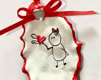 Adorno de concha de ostra con forma de corazón volador