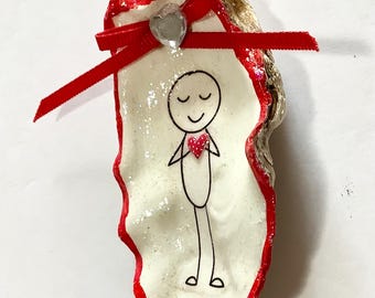 Adorno de concha de ostra con forma de latido del corazón