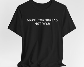 Camiseta "Haz pan de maíz, no guerra"