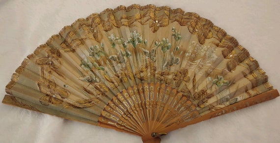 Antique hand fan hand painted. Detailed with gold