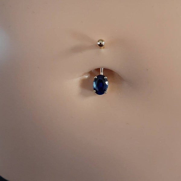 Navel Ring Solid 14-karat gold featuring a oval faceted Sapphire 8x6mm. (14 gauge = 1.6mm)  with a 4.0 round top bead.