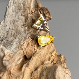 14k solid gold dermal implant. Pear shaped yellow sapphire dermals
