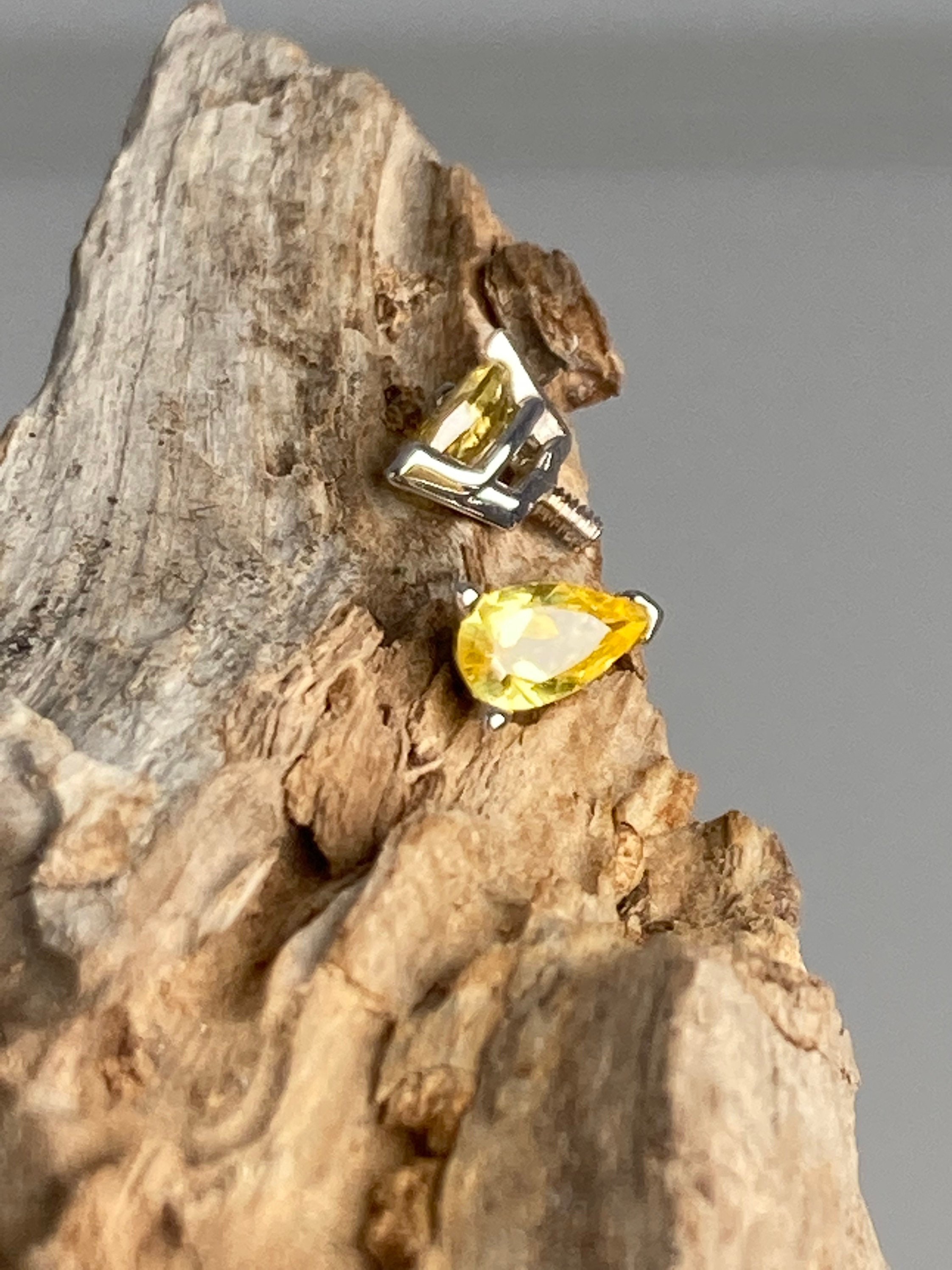 14k solid gold dermal implant. Pear shaped yellow sapphire dermals