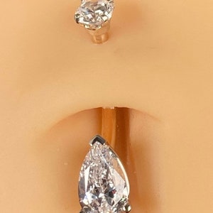 14 karat solid gold belly button ring.- Pear-shaped zirconia 8x5mm two tone 14 karat yellow and white gold Navel Rings. 14gauge