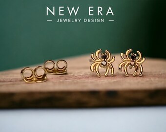 14k gold Black Diamond Spiders earrings. Friction back studs sold as a set. Spooky blackwidow spider body jewelry.